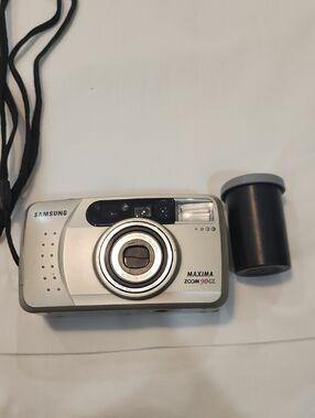 Samsung Silver Point-and-Shoot Film Camera with Black Film Canister